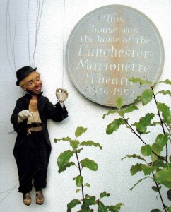 The tramp clown puppet outside Foley House, the former Marionette Theatre