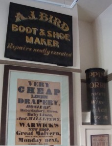 Posters and signs advertising some Malvern shops